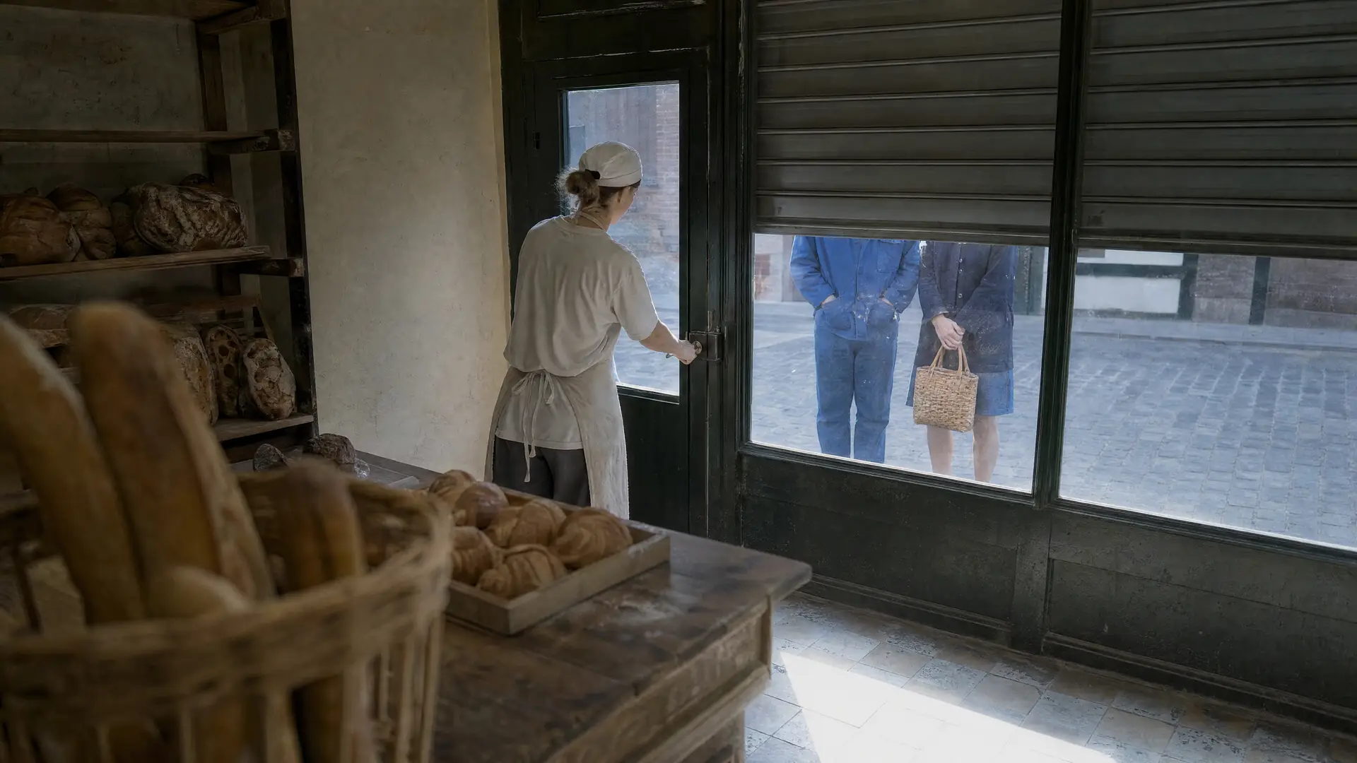 The shutter going up, first customers, white morning light.